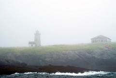 Libby Island Light on Rocky Hilltop in Dense Fog